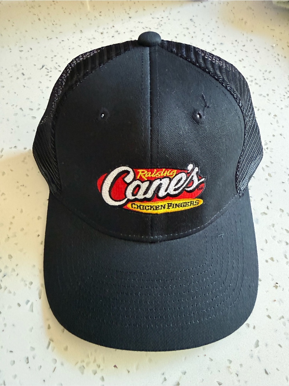 Raising Cane's Black Trucker Hat - Red, White & Yellow Logo